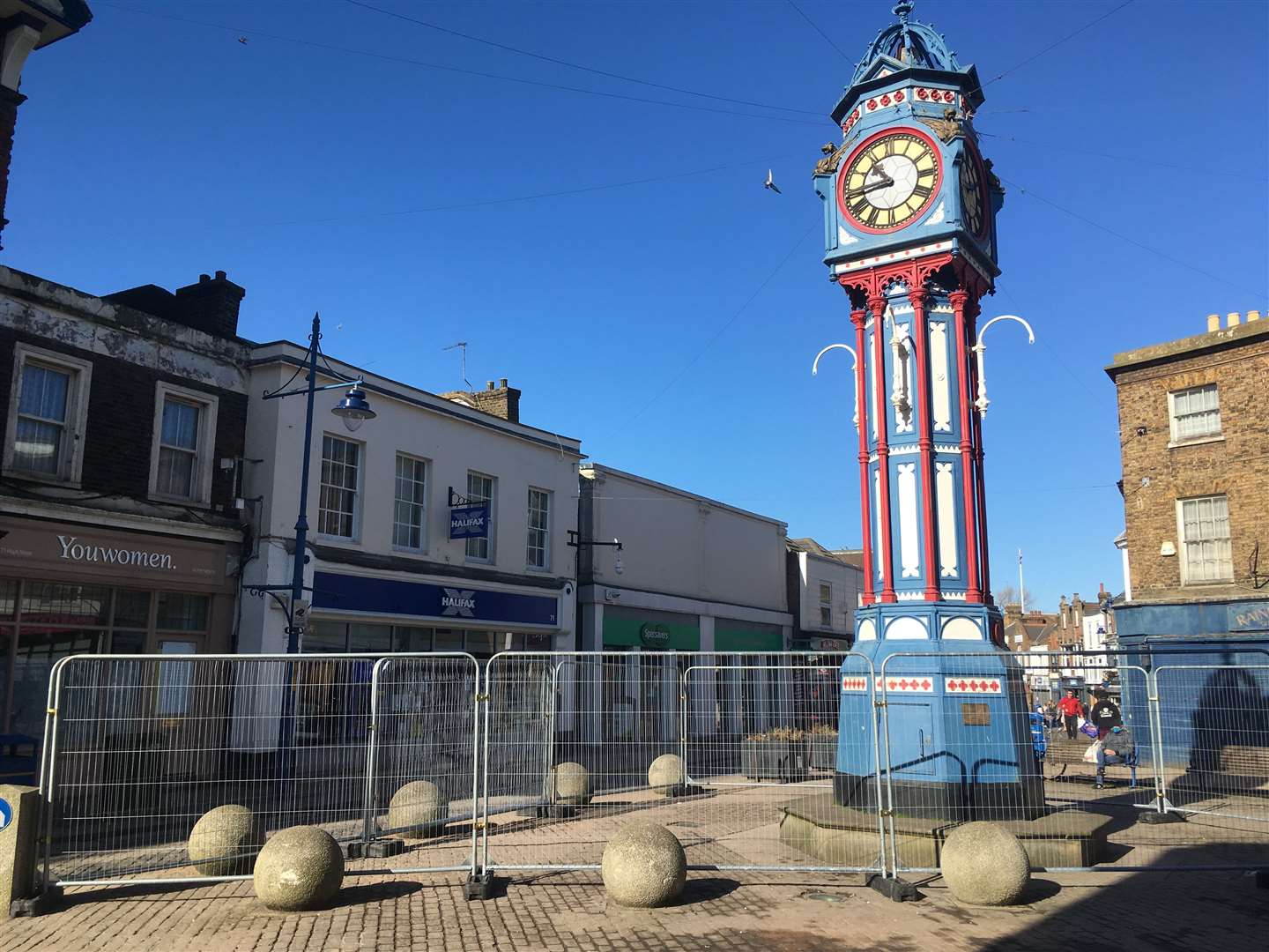 The clock tower, which was fenced off in February, has been blue, red and white in recent years