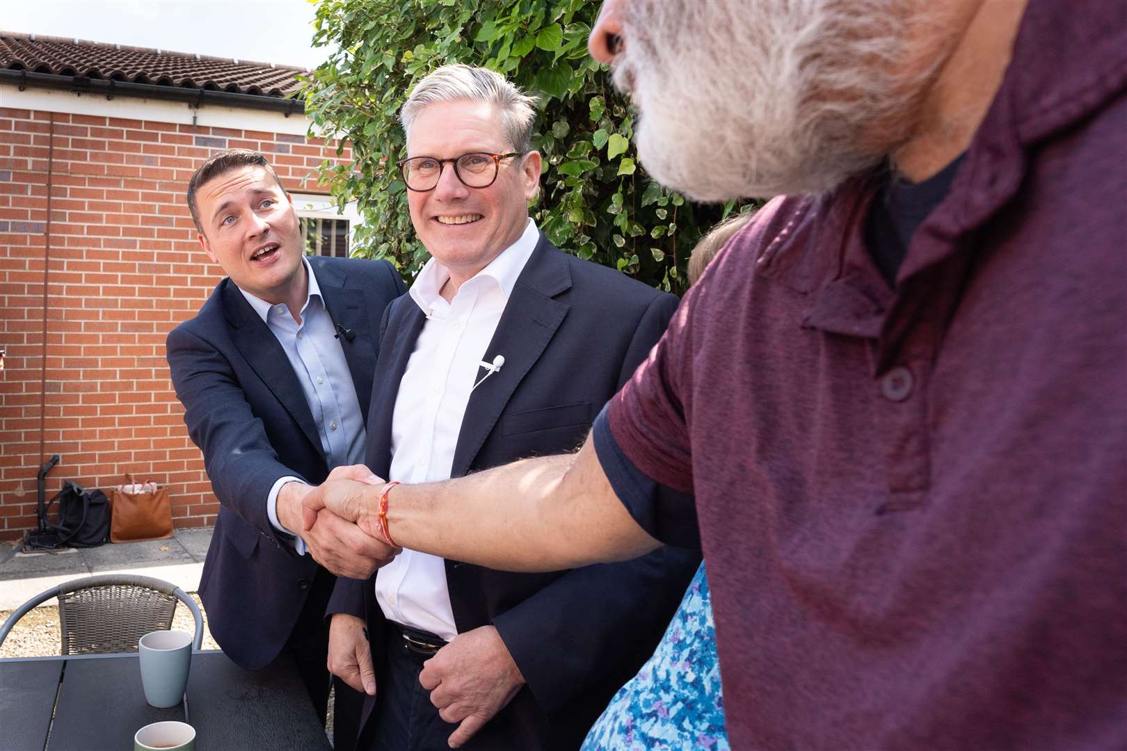 Sir Keir and Mr Streeting meet the locals in Coalville, East Midlands (Stefan Rousseau/PA)