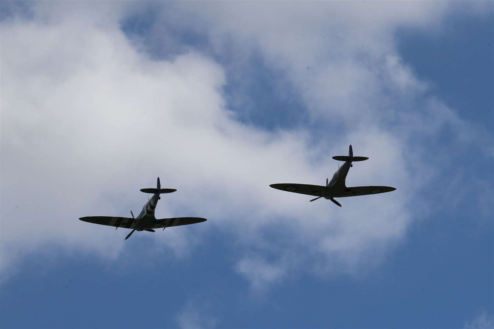 Two Spitfires from the Battle of Britain Memorial flight pass overhead (Gareth Fuller/PA)