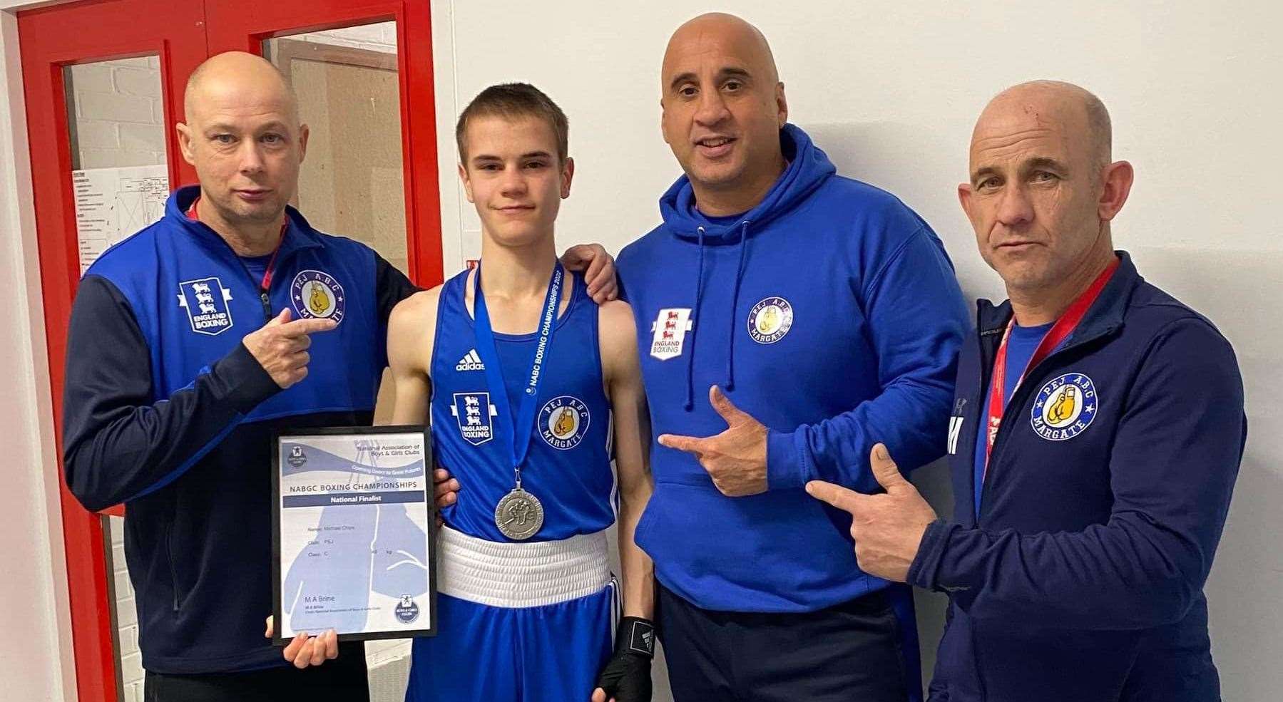 PEJ ABC Margate boxer Michael Chipps with club coaches as he celebrates earning a silver medal