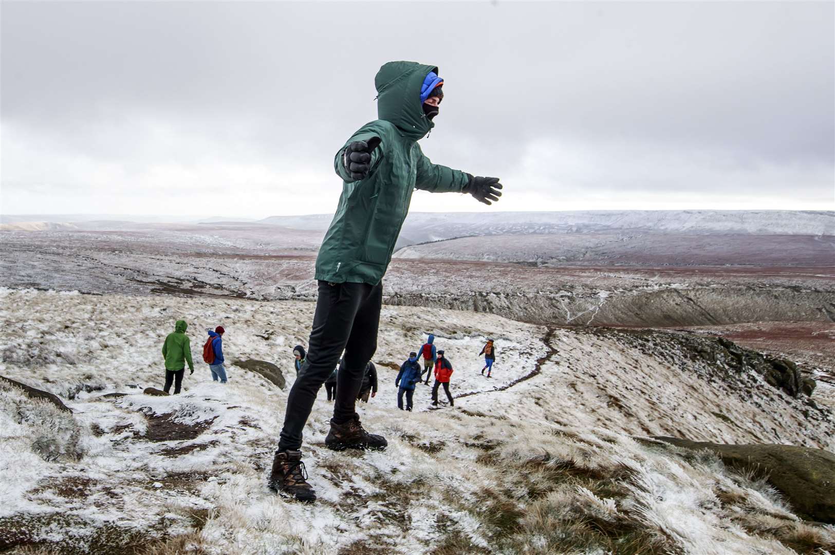 Hikers faced snow and high winds on Bleaklow Moor in the Peak District (Danny Lawson/PA)