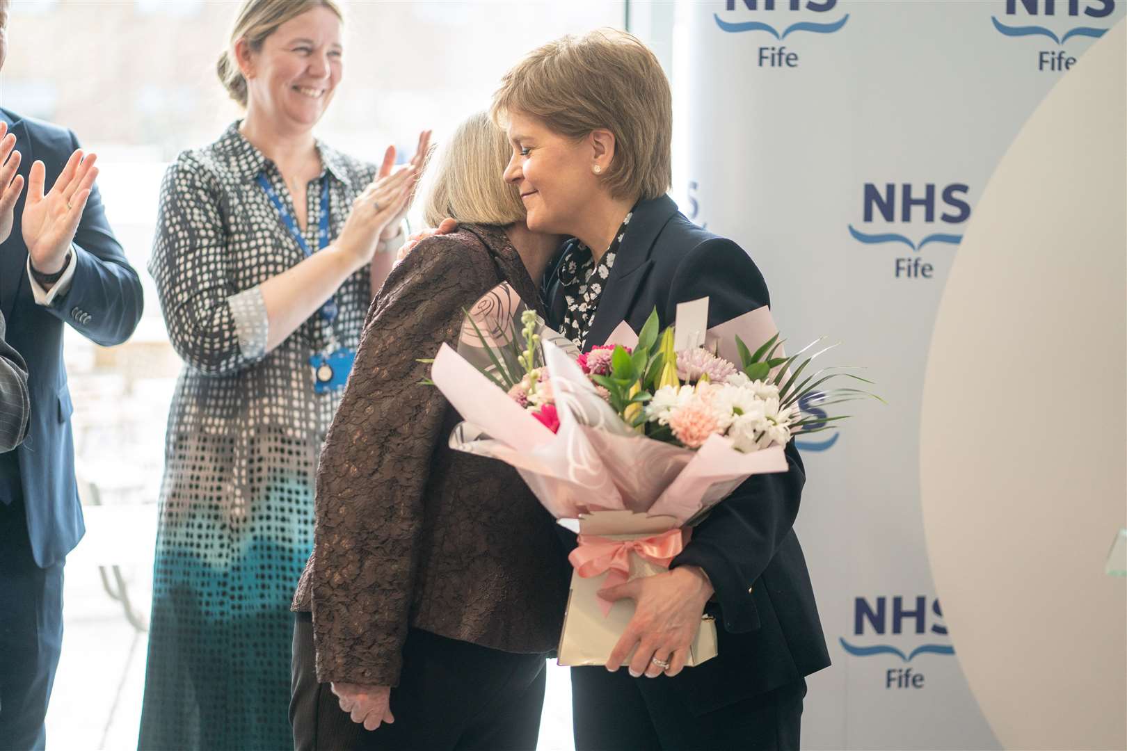 Nicola Sturgeon was given a large bouquet of flowers during what was her final official engagement as First Minister (Peter Summers/PA)