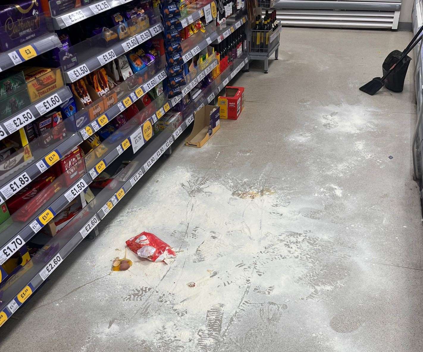 A pregnant woman had eggs and flour thrown at her after youths trashed a Tesco Express in Paddock Wood