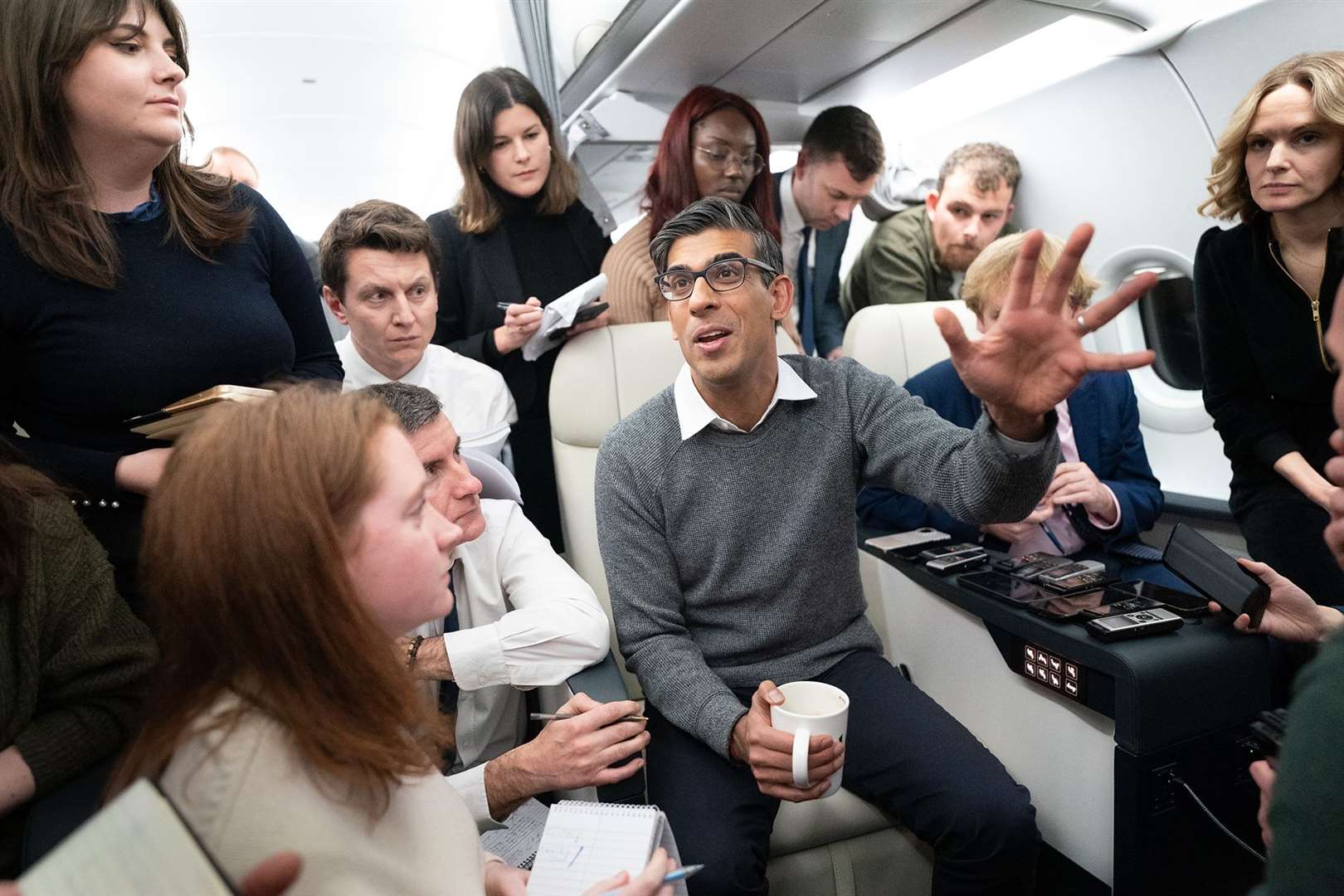 Prime Minister Rishi Sunak speaks to journalists on the plane to Dubai for the Cop28 summit (Stefan Rousseau/PA)