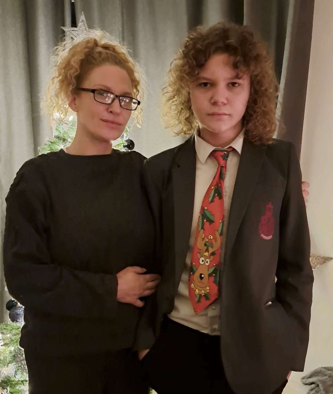 Natasha Parry and her son Lenny wearing the Christmas tie