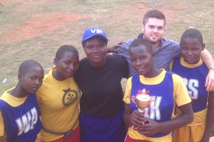 Lee Adkin with the winning team from the SJCC's netball tournament.