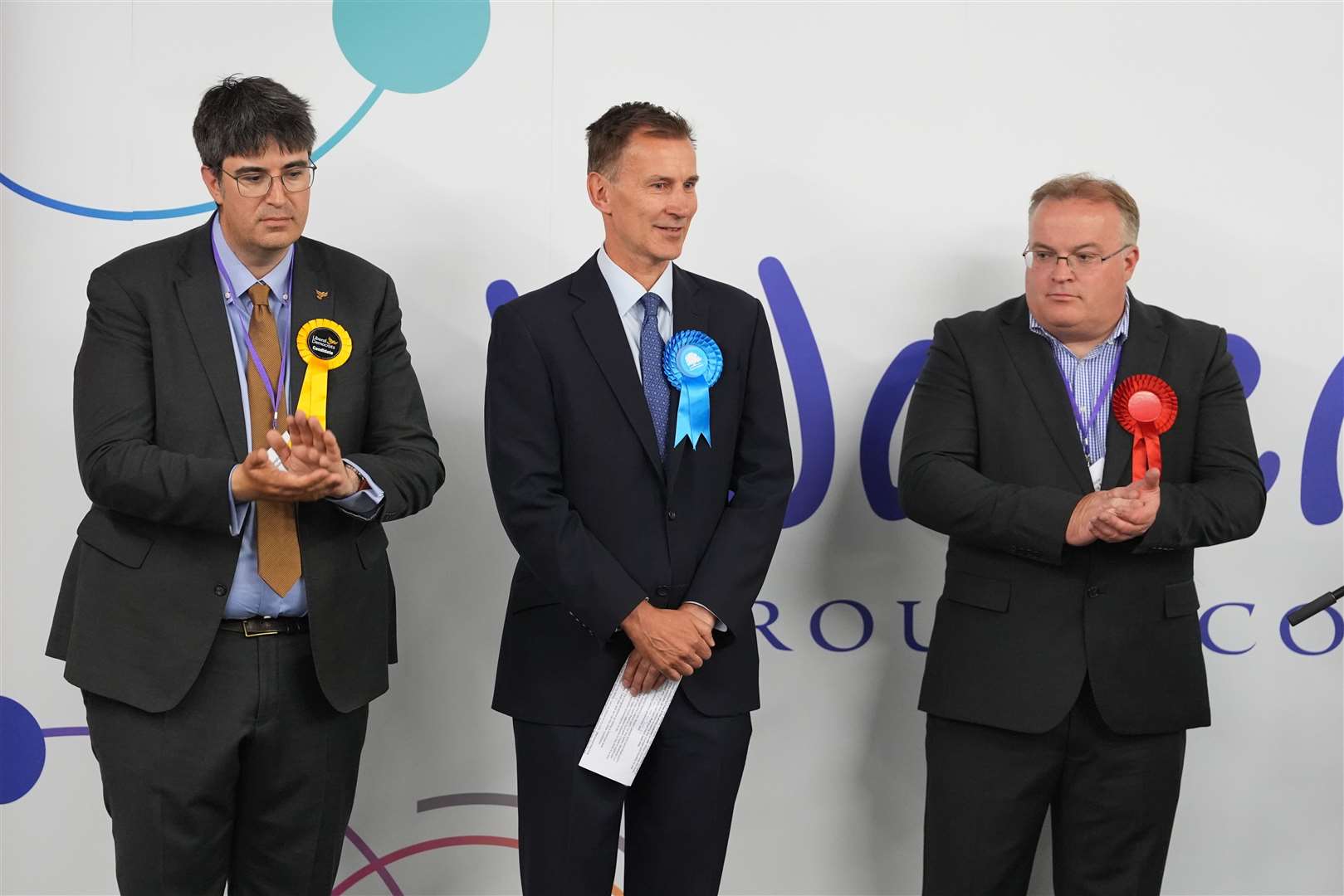 Jeremy Hunt, centre, has won in Godalming and Ash, Surrey (Gareth Fuller/PA)