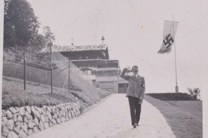 Hitler in a "Charlie Chaplin" style salute. Picture from C&T Auctioneers and Valuers.