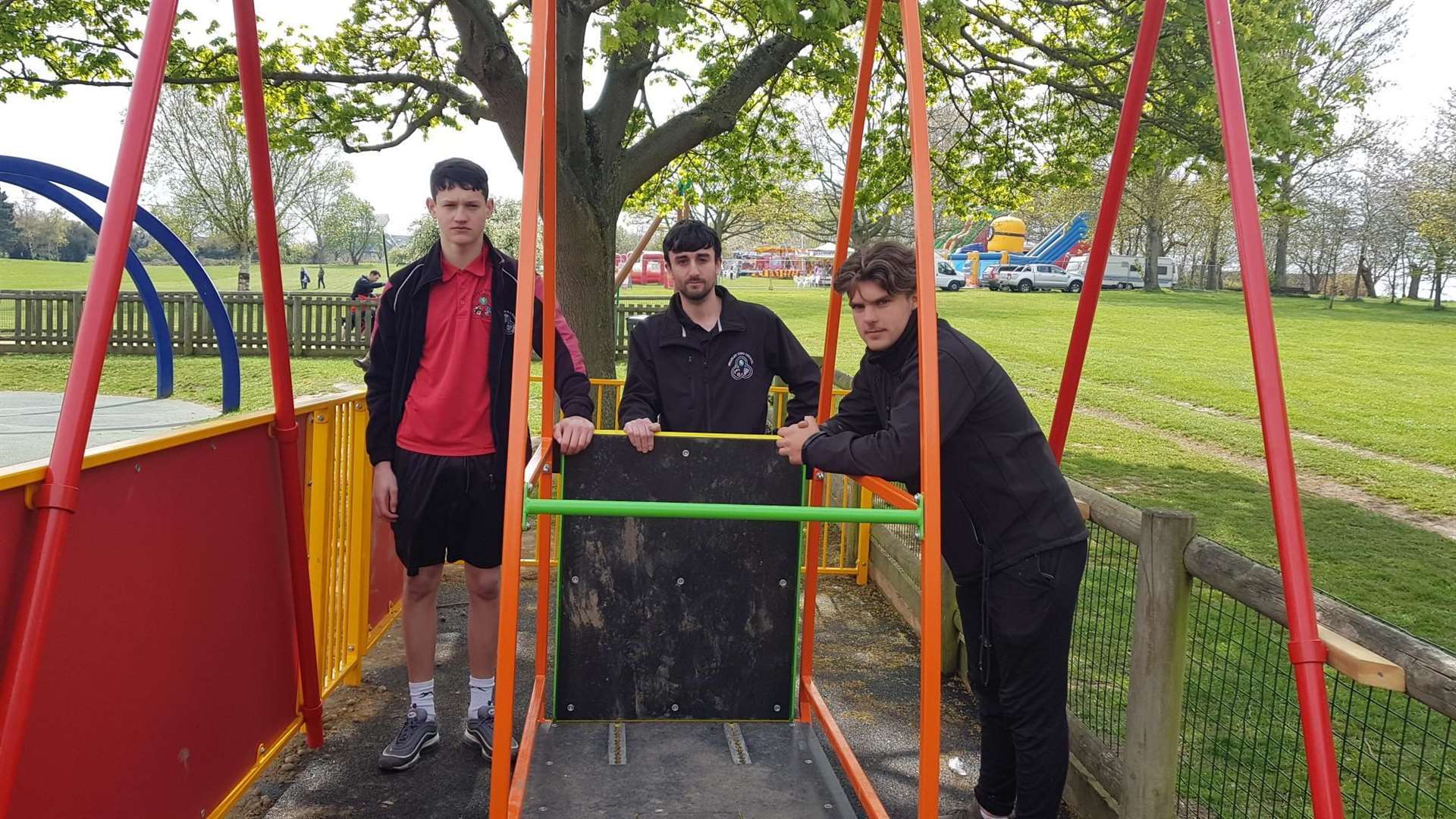 Park supervisor Barney Simmons, park director Ryan Hayman and park supervisor Charlie Lambert guarding the swing following a break-in last year.