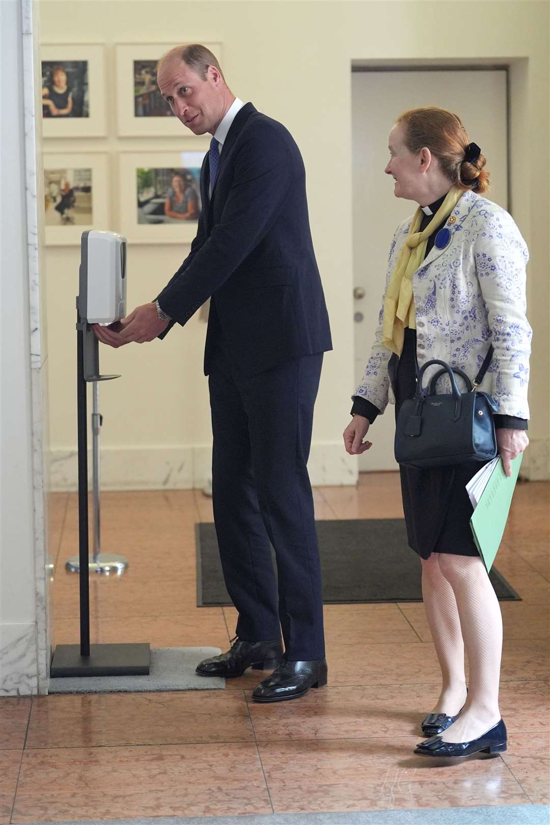 The Prince of Wales smiled as he used antibacterial hand gel on his arrival at the event (Yui Mok/PA)