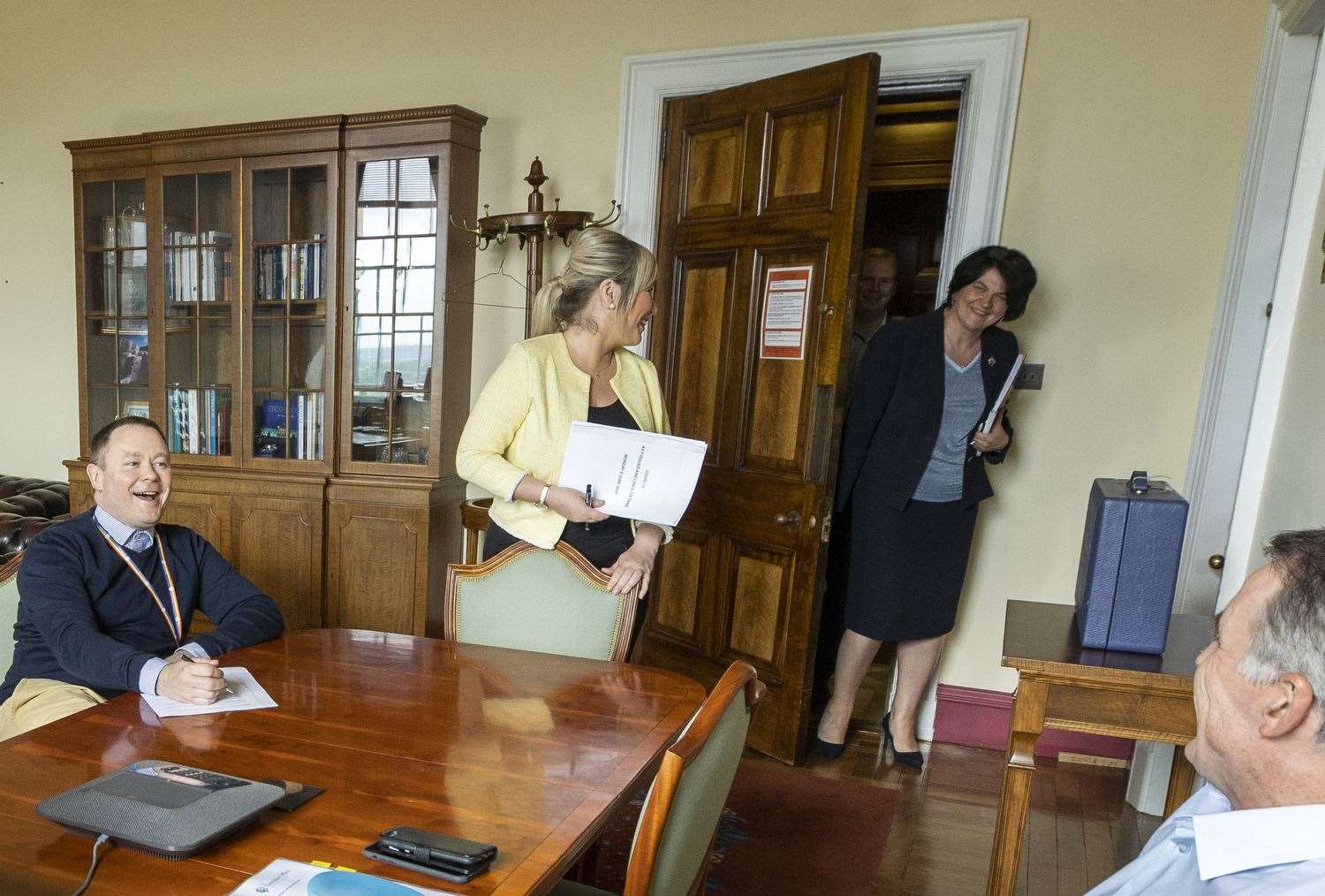 Mrs Foster walks into the office of the Deputy First Minister (Liam McBurney/PA)