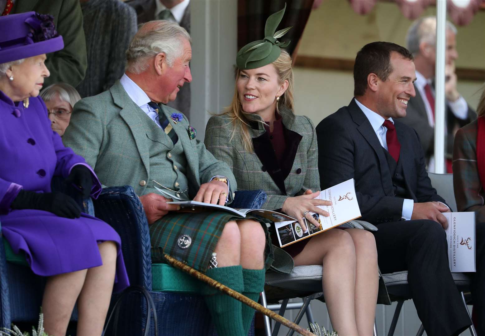 Autumn Phillips chats with the Prince of Wales during the Braemar Royal Highland Gathering in Braemar (PA)