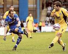 Barry Fuller puts in a cross against Rochdale