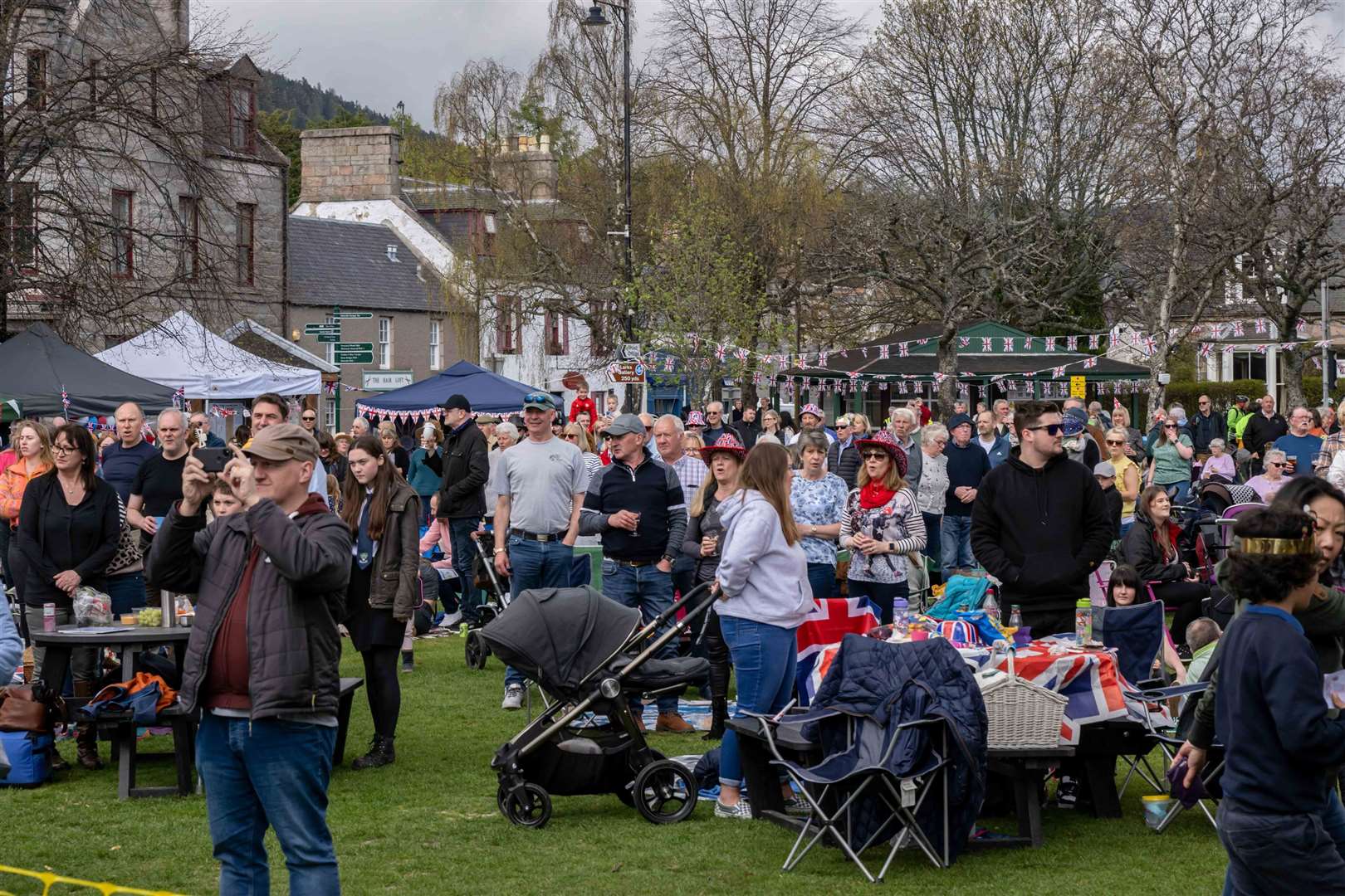 People attending a Coronation Big Lunch picnic in Ballater on Sunday (Michal Wachucik/PA)