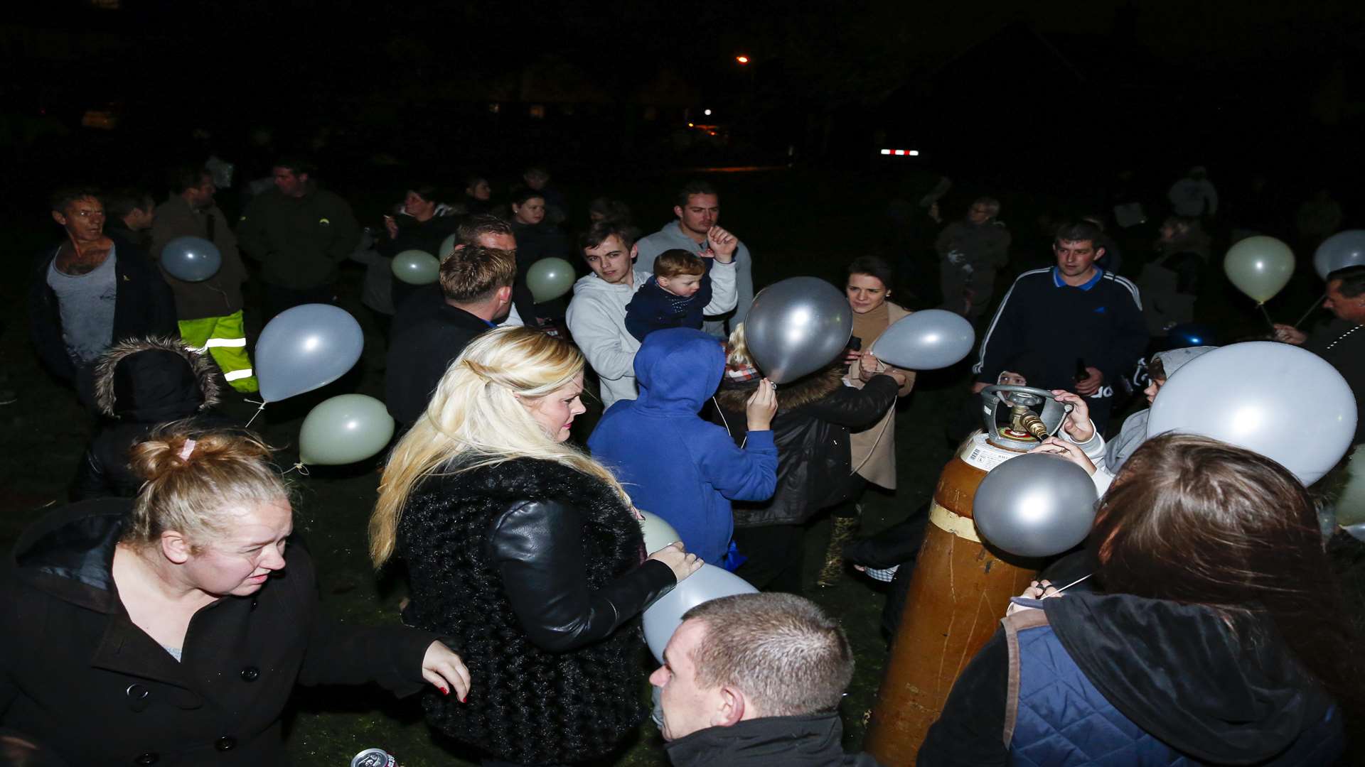 More than 100 people released balloons and lanterns