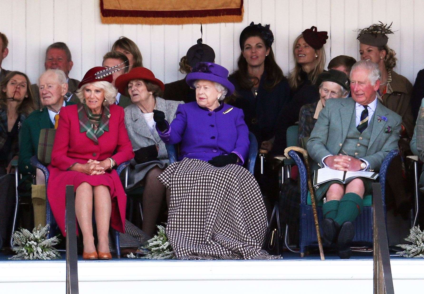 The Queen with Charles and Camilla during the 2019 Braemar Gathering (Andrew Milligan/PA)