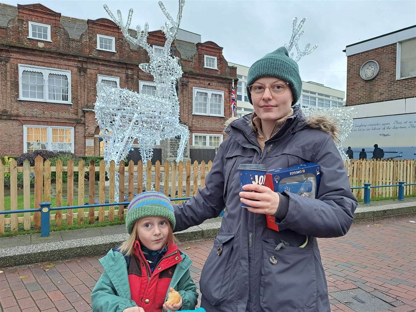 Alice Ferry with her son Rory Murphy in front of the sculptures, which she thinks are "pretty"