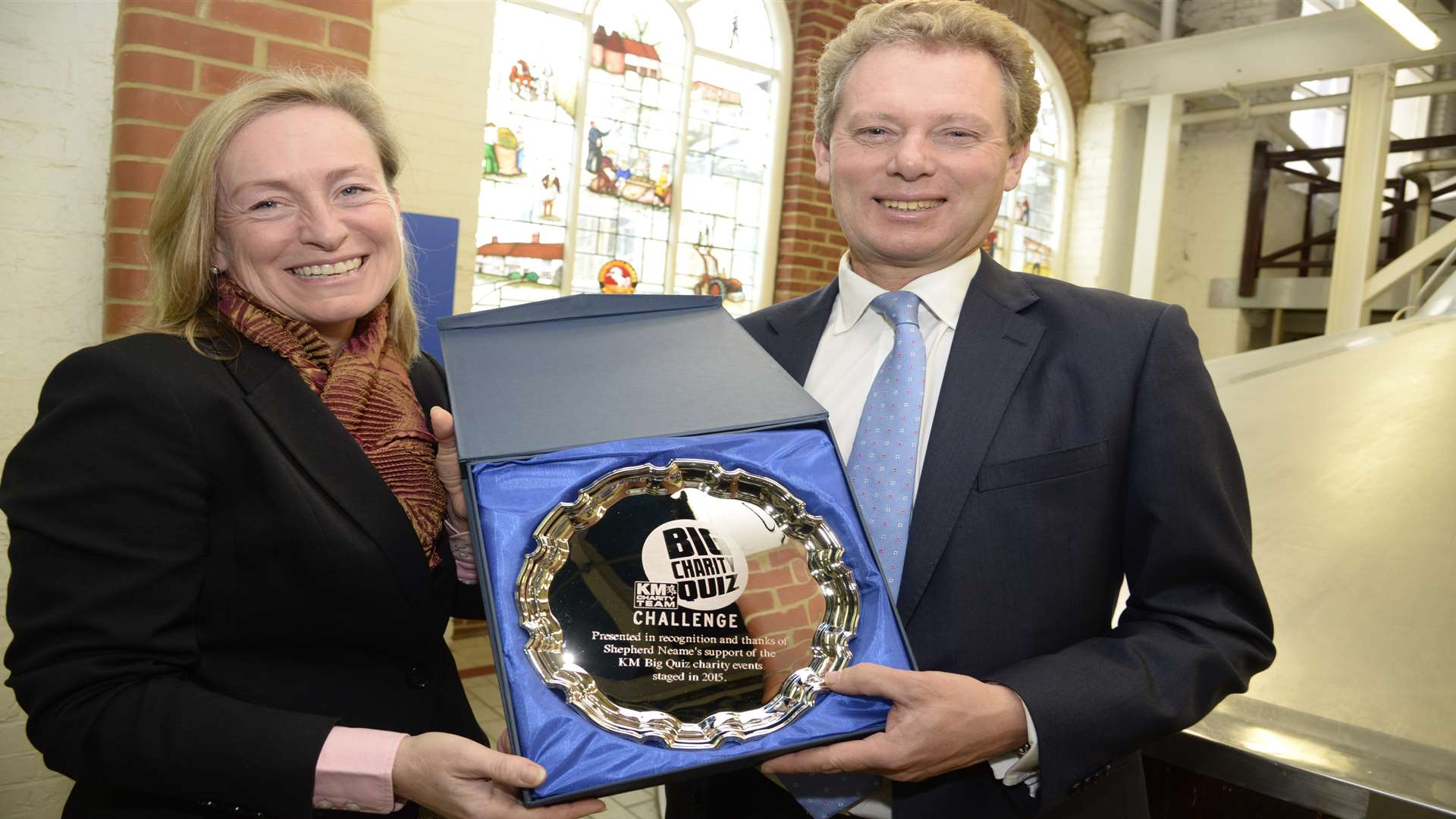 KM Group chairman Geraldine Allison presents Shepherd Neame chairman Jonathan Neame with a silver salver for supporting the KM Big Charity Quiz 2015.