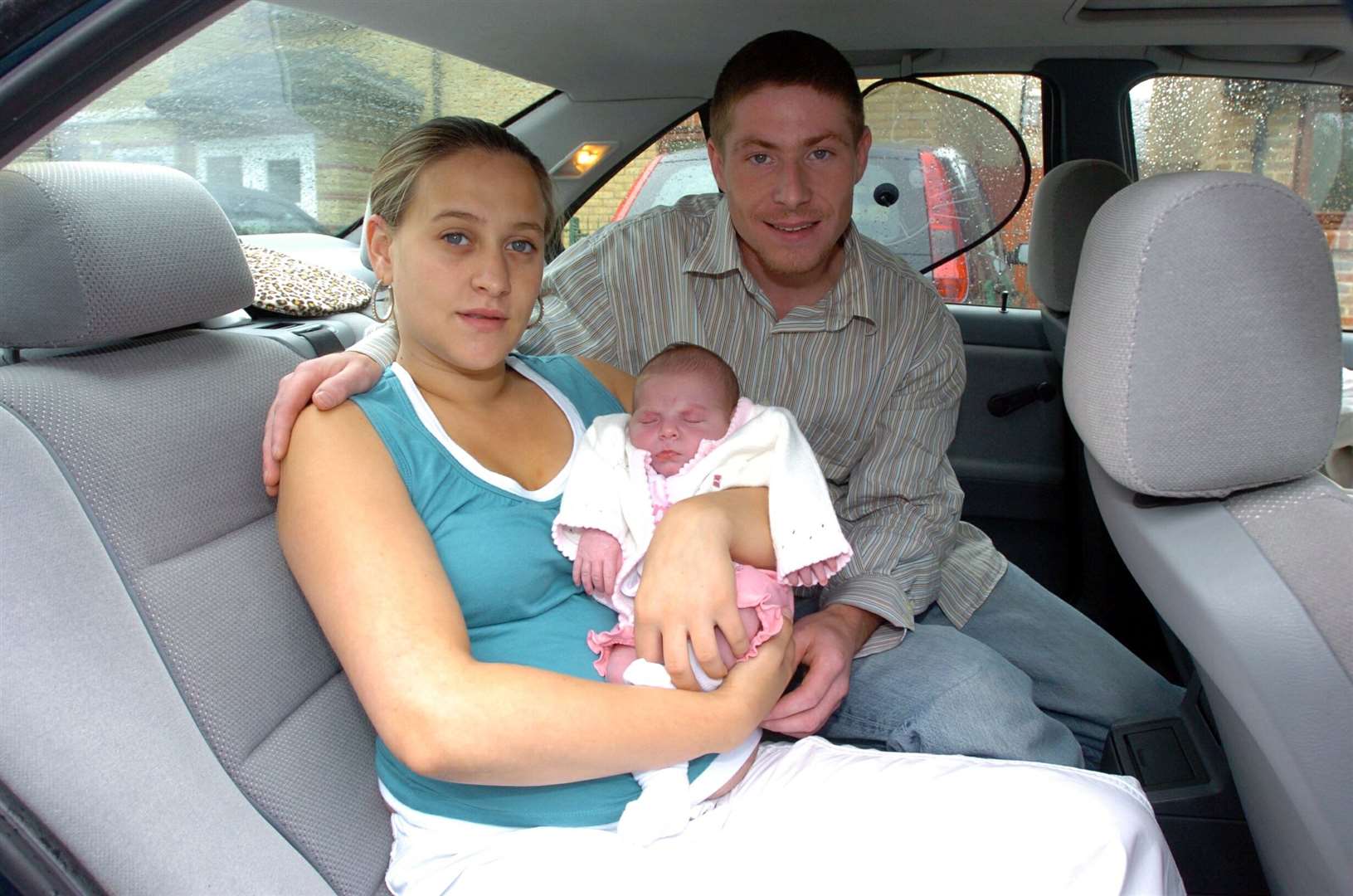 Laura Hollman and partner Michael Russell with baby Mia, 16 years ago