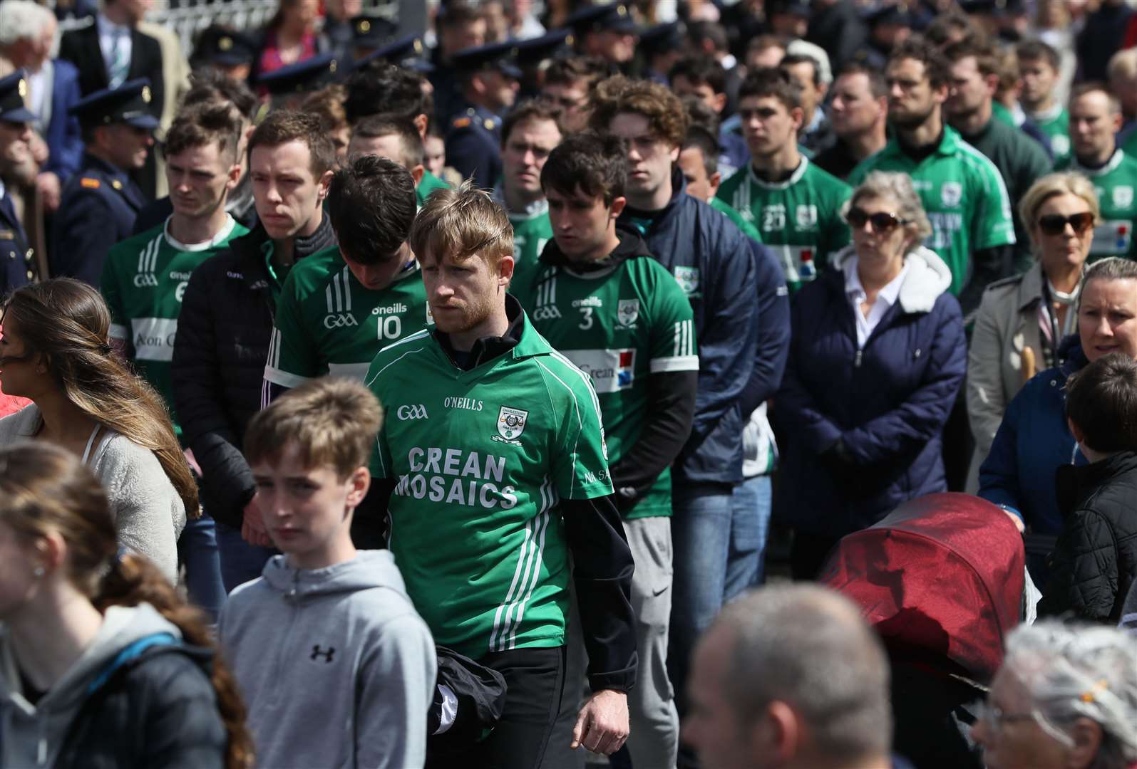 Members of Charlestown Sarsfields GAA club walk behind the coffin of Detective Garda Horkan (Brian Lawless/PA)