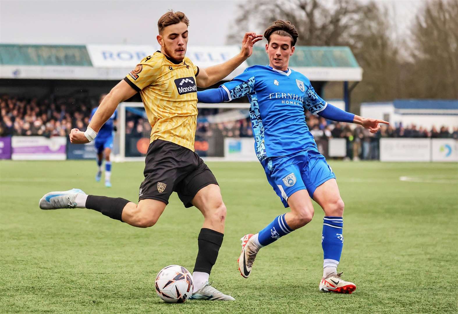 Antony Papadopoulos gets in a cross from the right, tracked by Charlie Pegrum. Picture: Helen Cooper