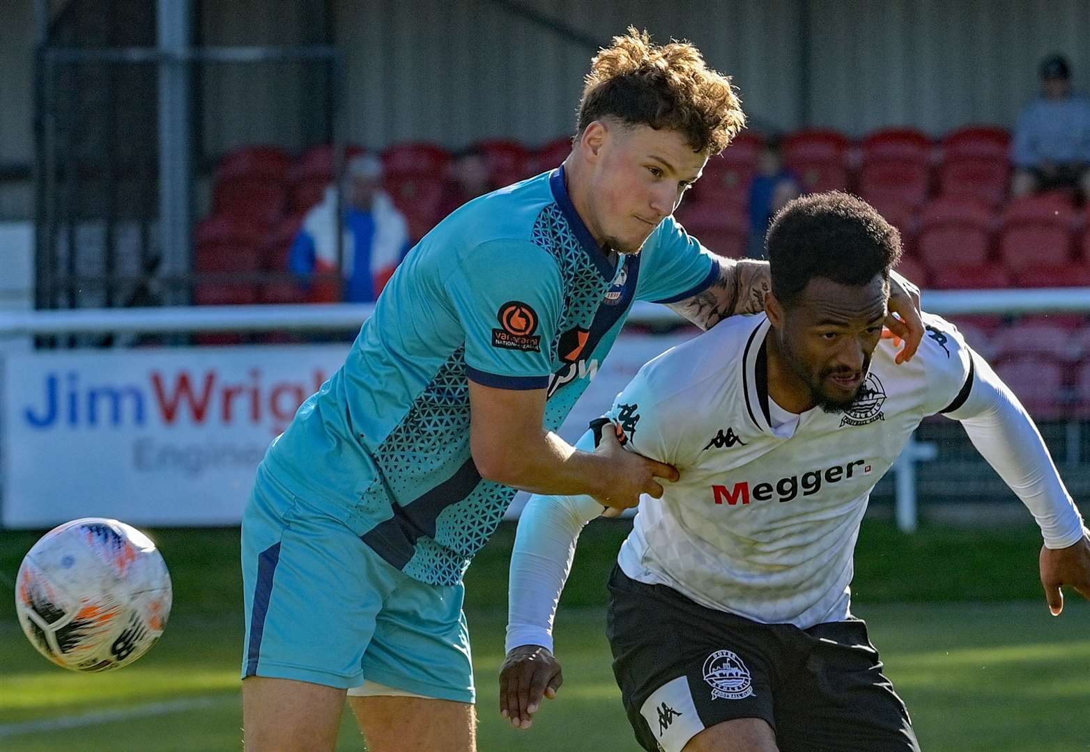 A Braintree player not giving Dover's Chike Kandi a moment's peace. Picture: Stuart Brock