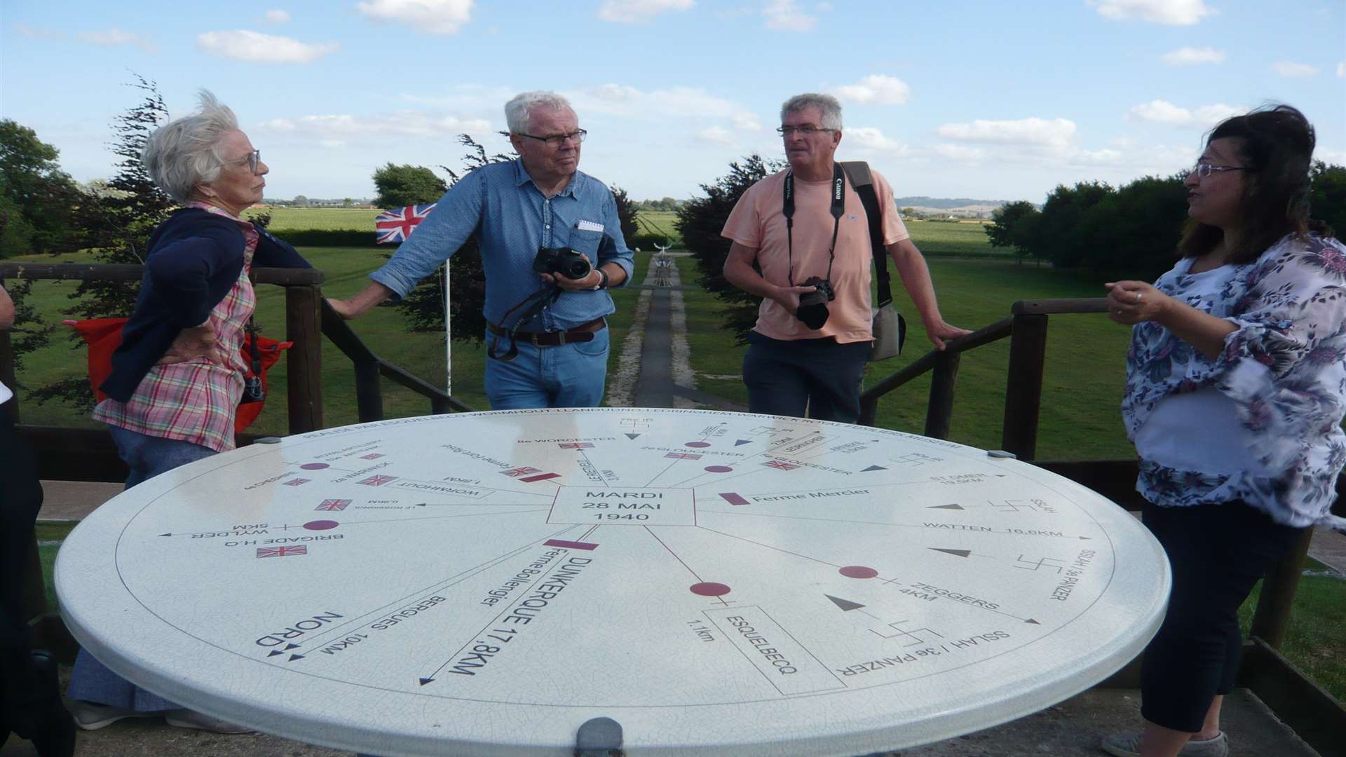 A group understands the horrors during a tour of the memorial at La Plaine au Bois, Esquelbecq.