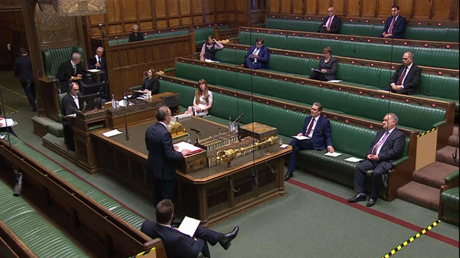 MPs practise social distancing as Foreign Secretary Dominic Raab speaks during Prime Minister’s Questions in the House of Commons (House of Commons/PA)