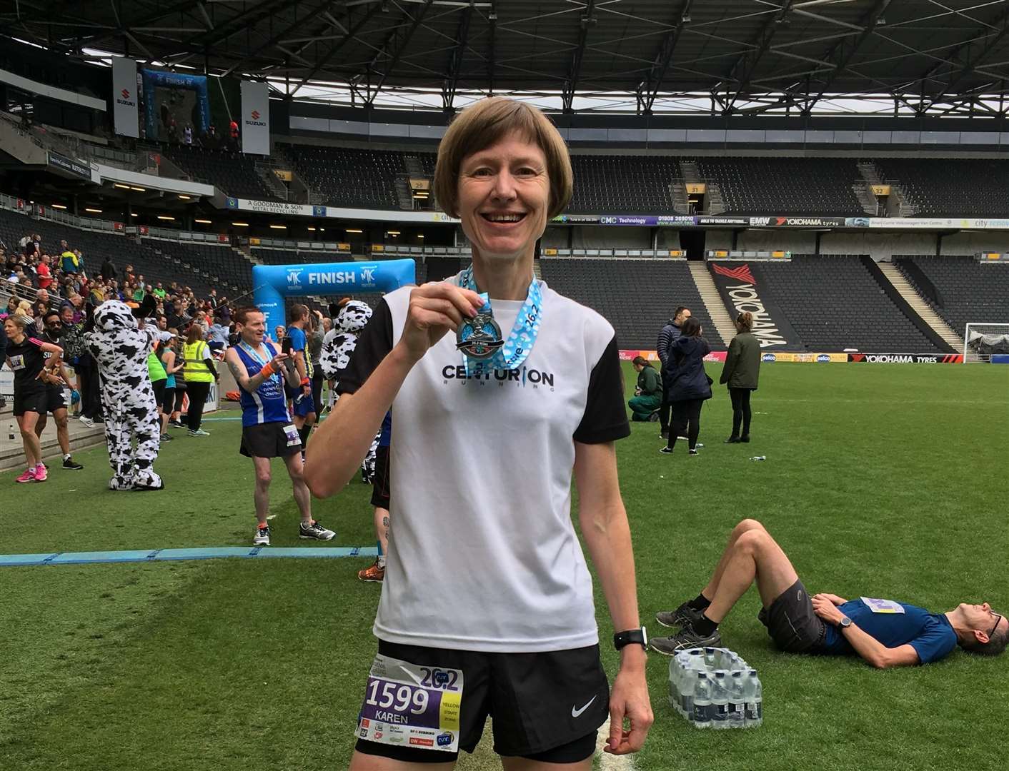 Karen at the end of Milton Keynes Marathon in 2019, where she ran her only under-four hour marathon