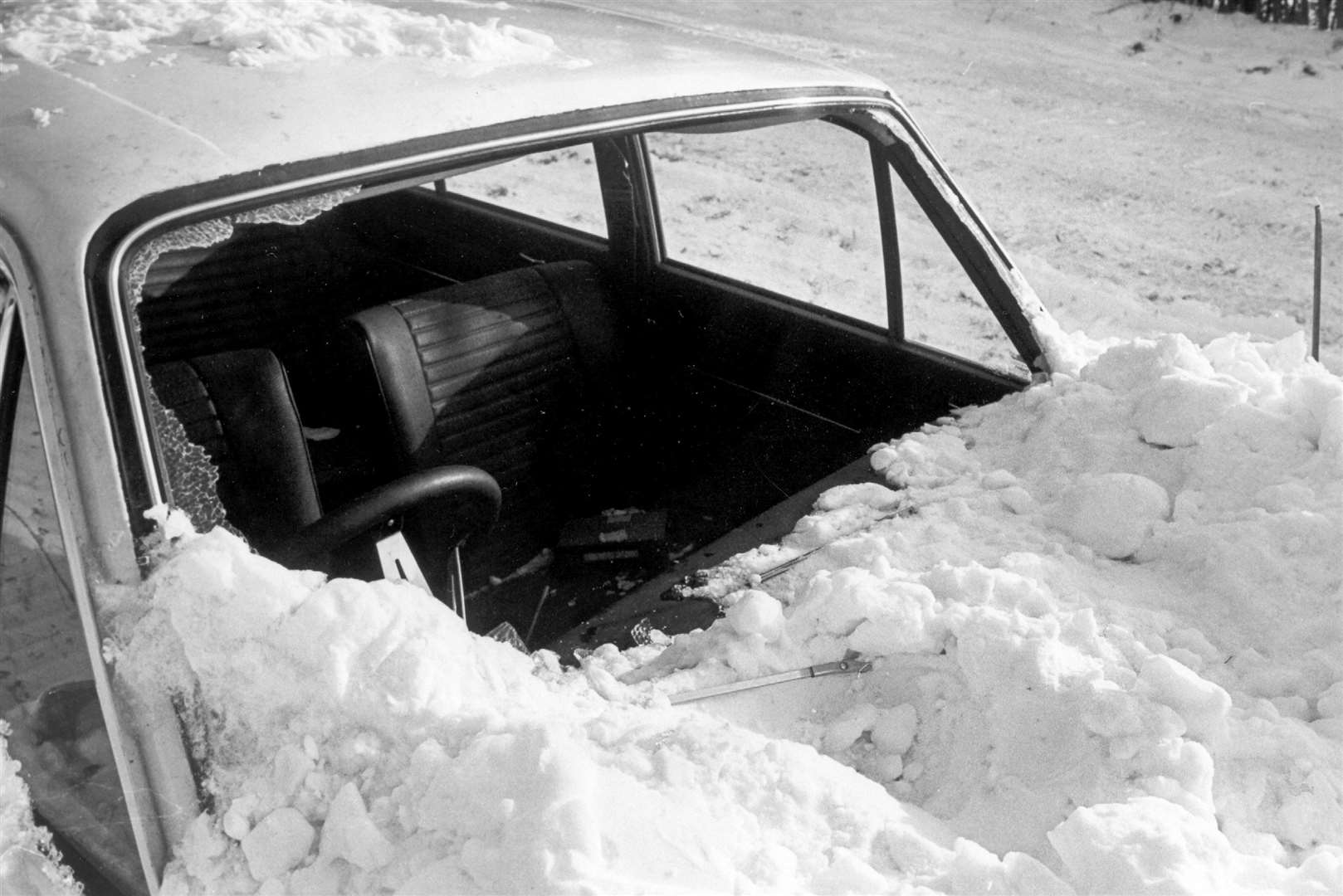 This car's window shattered under the sheet of white stuff