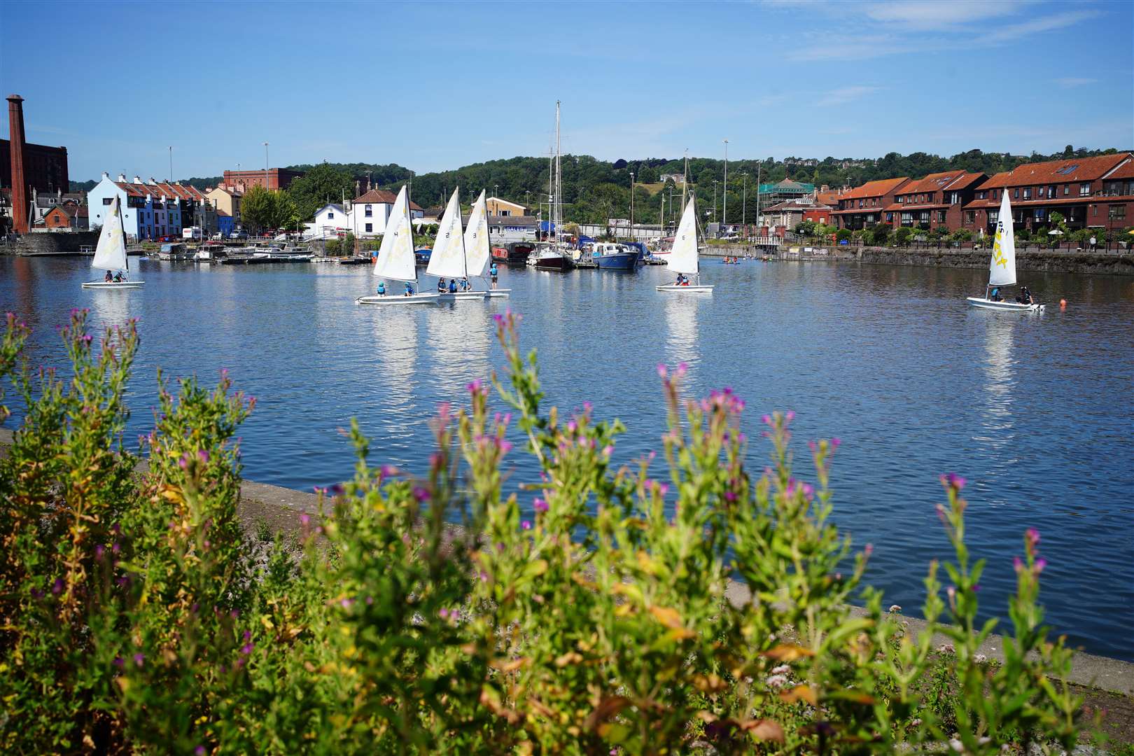 Yachts sail through the water at Bristol Harbour (Ben Birchall/PA)