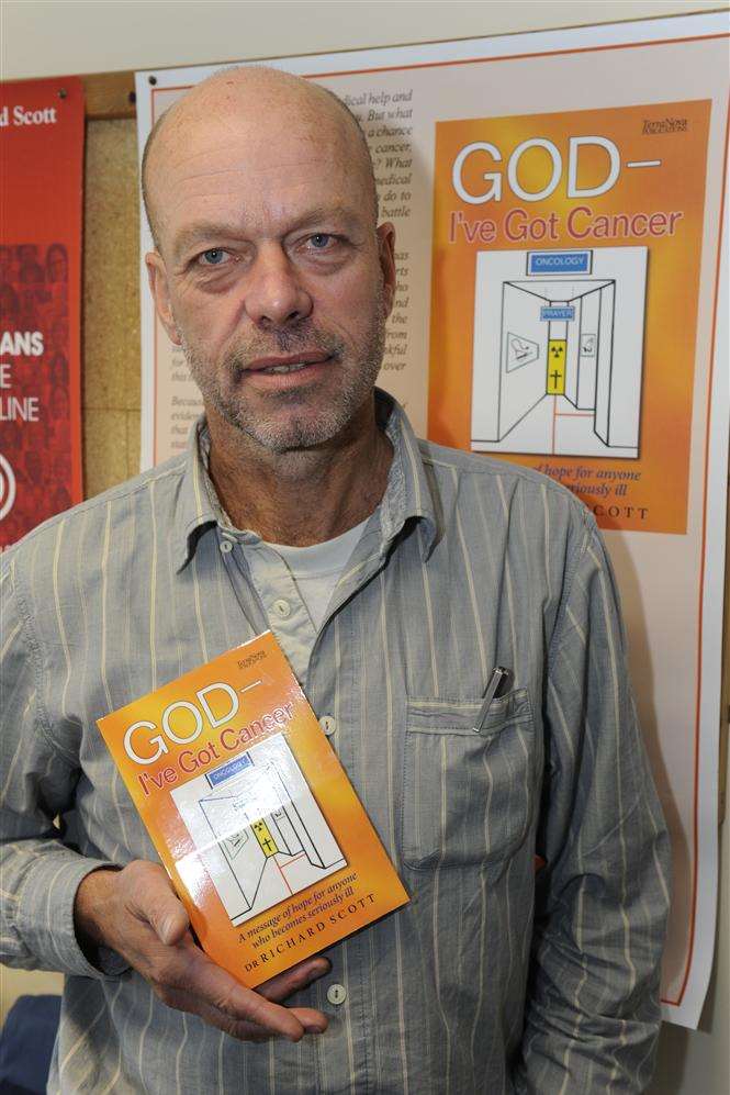 Kingsgate dad and GP Dr Richard Scott, of Bethesda Medical Centre, Margate, with his book God - I've Got Cancer