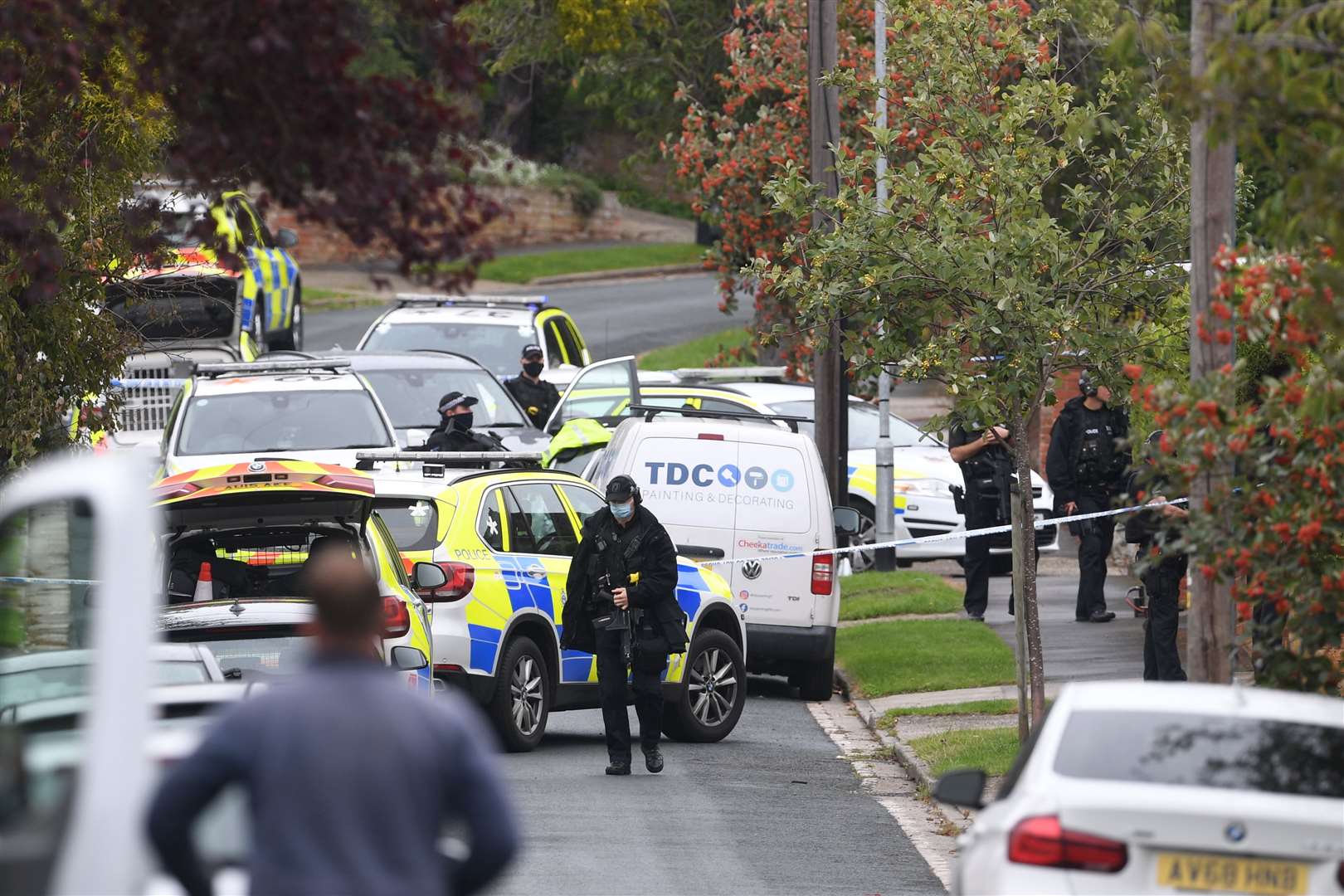 Armed police officers outside a property on Westwood Avenue, Ipswich (Joe Giddens/PA)