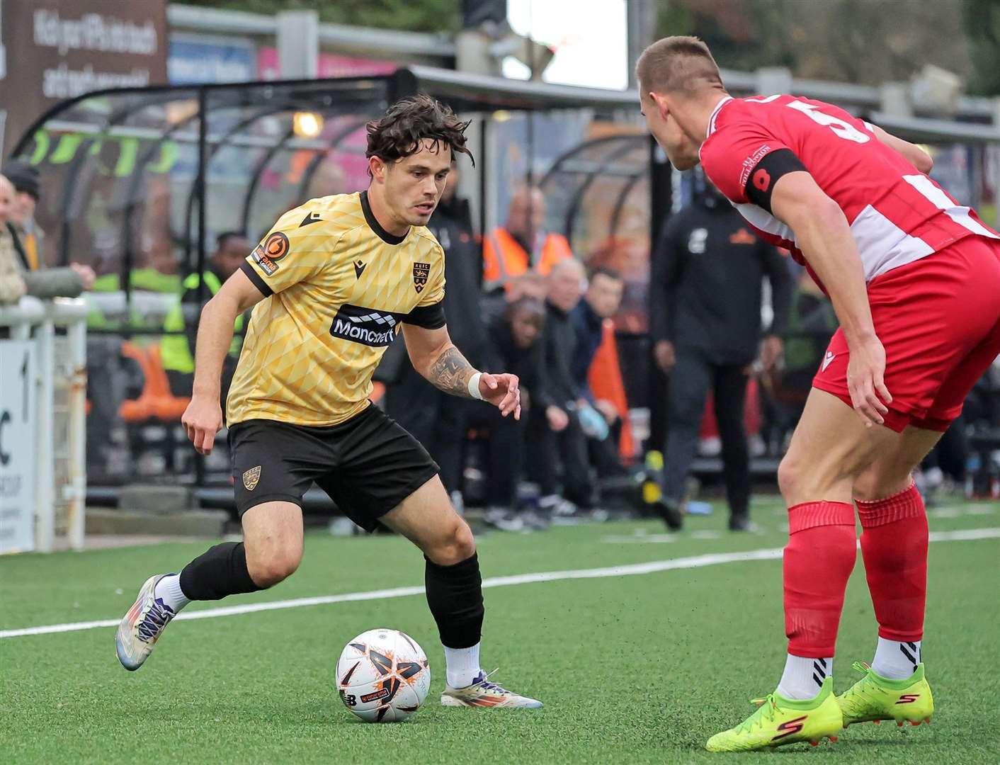 Jon Benton takes on Hornchurch defender Harry Gibbs. Picture: Helen Cooper