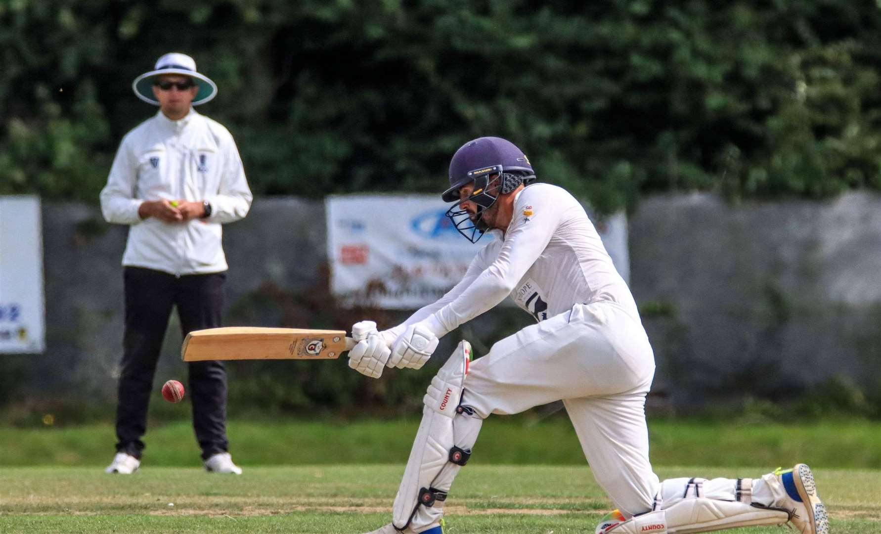 Lordswood captain Calum MacLeod gets the slog-sweep out before he goes for 21. Picture: Allen Hollands