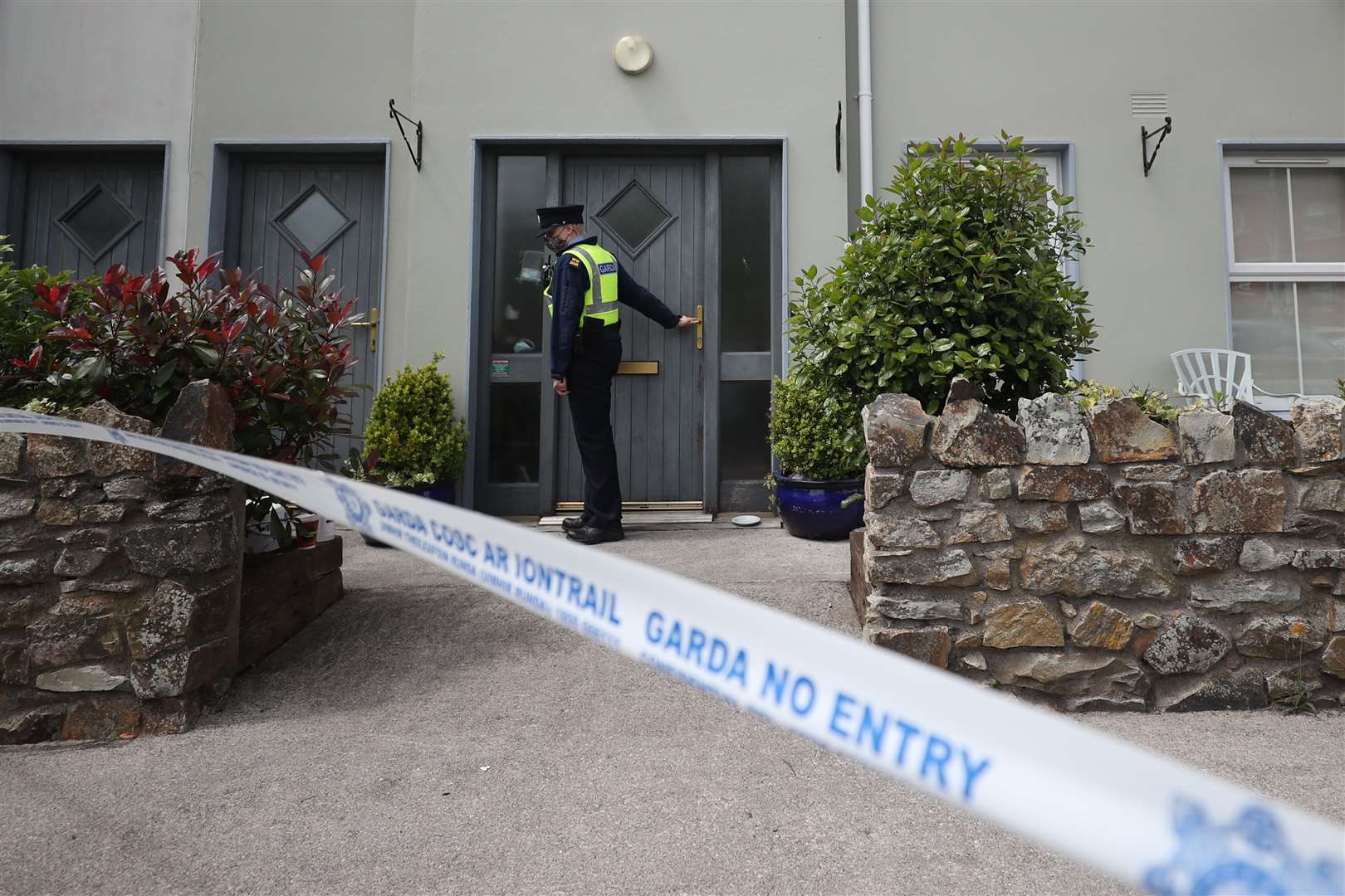 Gardai at the house in Clashmore, Co Waterford (Niall Carson/PA).