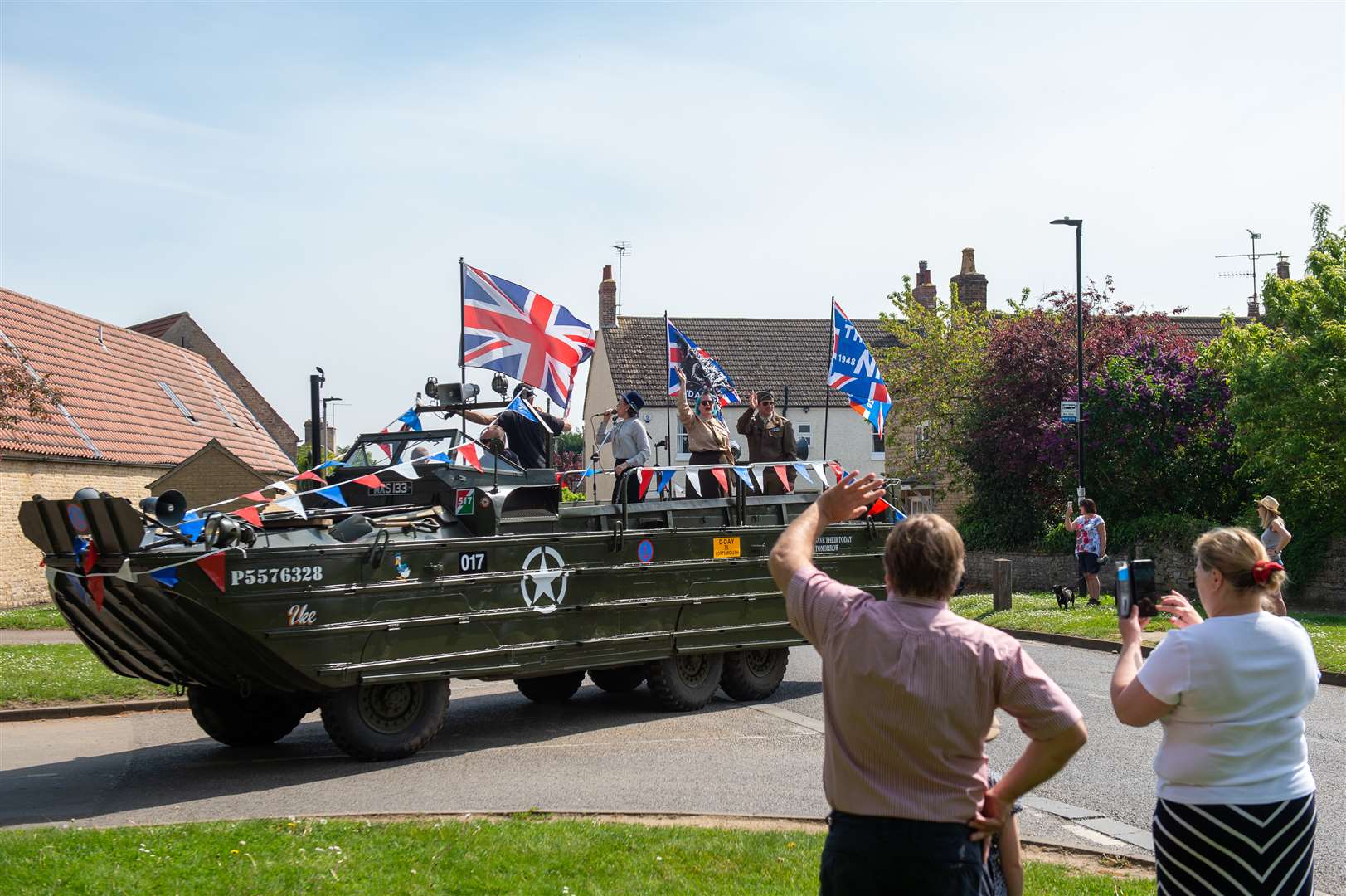 A restored Second World War amphibious DUKW vehicle drives through Helpston near Peterborough (Joe Giddens/PA)