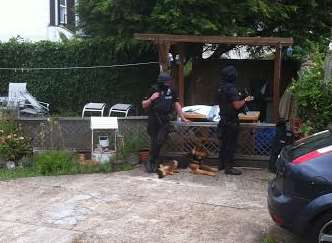 Armed police with dogs at the scene