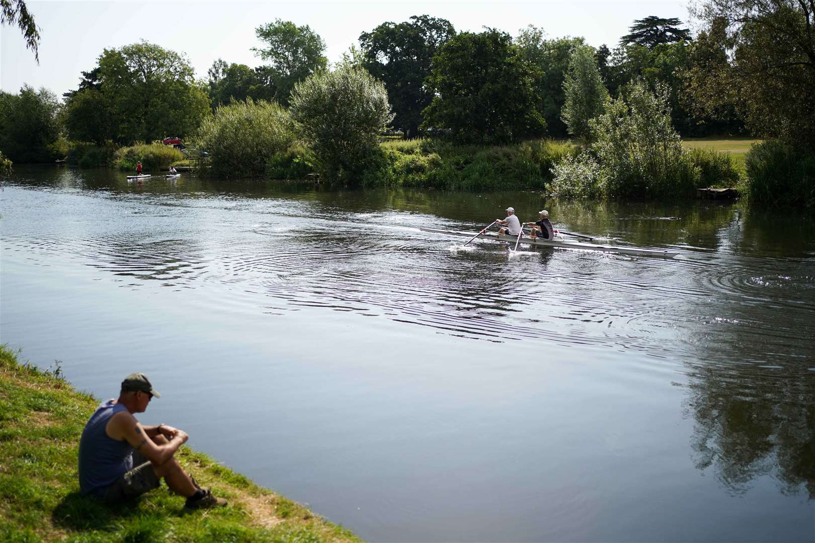 These people on the river Avon in Warwick sought out water in another way (Jacob King/PA)