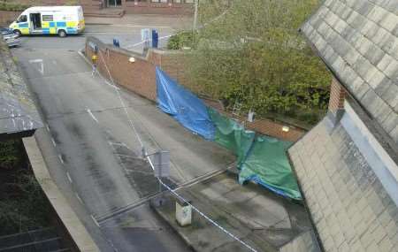 Police cordoned off an area and erected screens. Picture: ANDY PAYTON