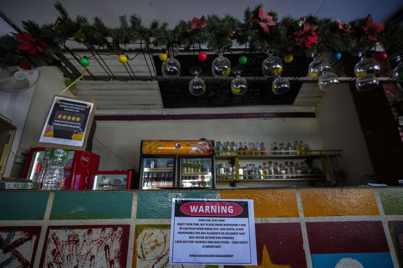 A notice displayed at the bar of Nana Backpack hostel in Vang Vieng, Laos (Anupam Nath/AP)