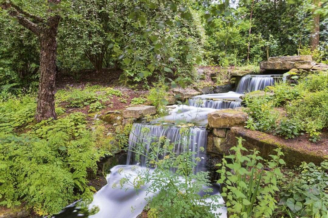 The garden’s waterfall helps to circulate water in the lake, thereby oxygenating and revitalising it (Royal Collection Trust/Her Majesty Queen Elizabeth II 2021/PA)