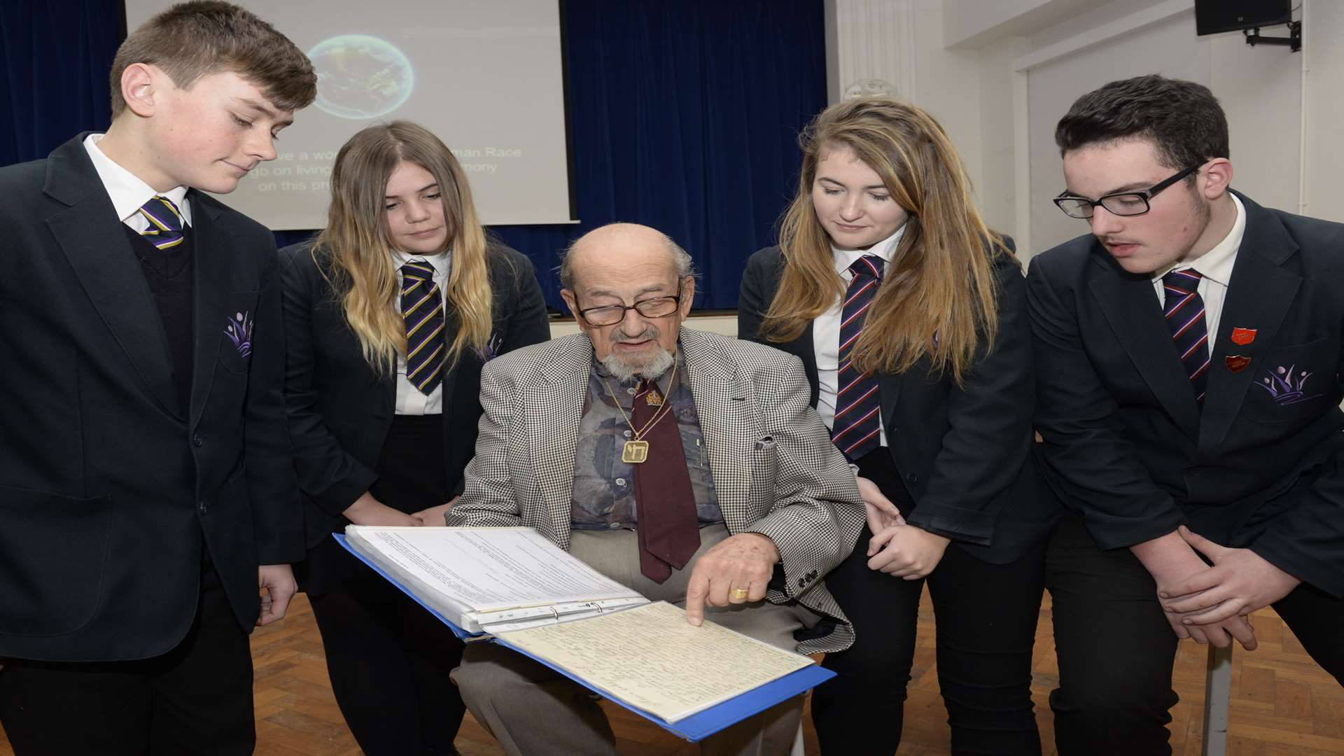 Holocaust survivor Harry Bibring talks with pupils Robin Raymonde, Ellie Kaye, Mercy Horsington-White, and Richard Hulks at King Ethelbert School, Birchington