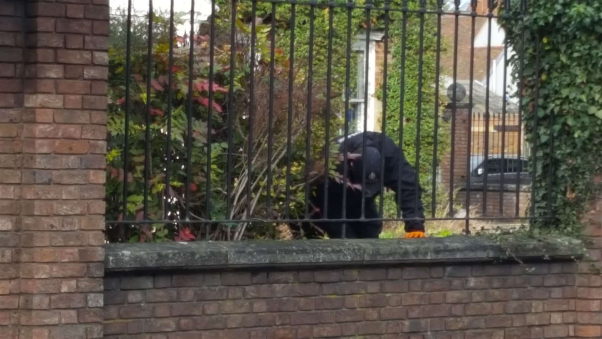 Officers in Knightrider Street looking for evidence after the killing of Welsey Adyinka