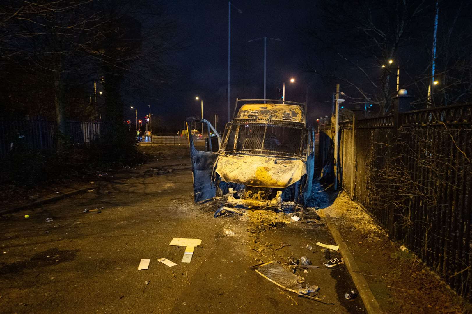 A police van was burnt out after a demonstration outside the Suites Hotel in Knowsley, Merseyside (Peter Powell/PA)