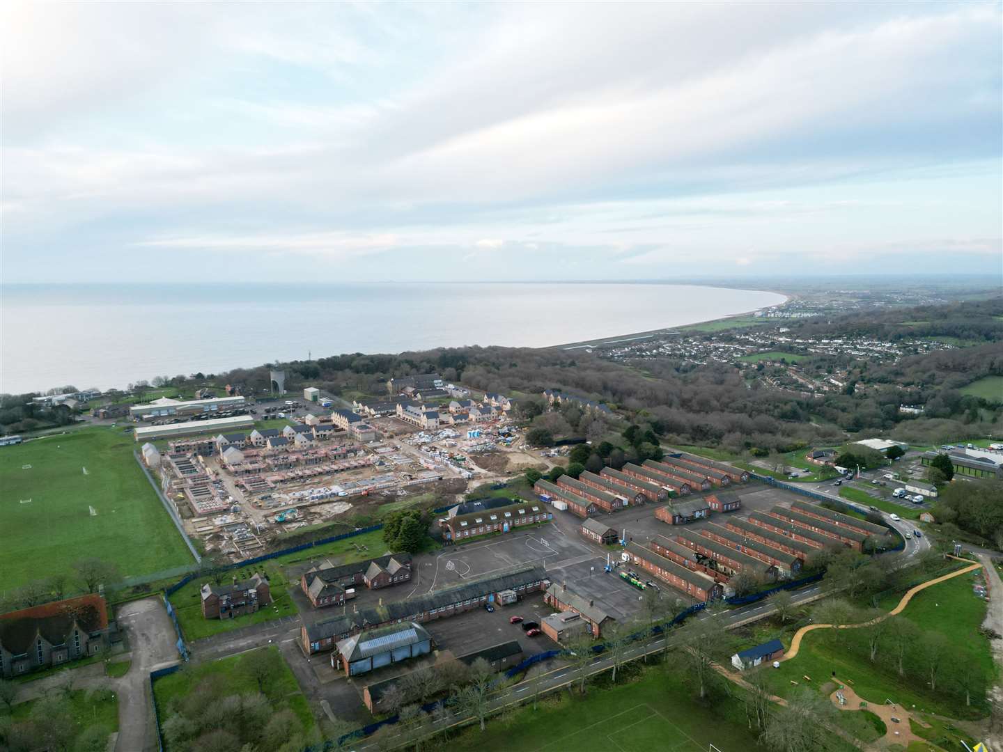 In the foreground is Napier Barracks, being used to accommodate asylum seekers. Beyond that is the former Burgoyne Barracks, flattened to make way for new homes. Picture: Barry Goodwin