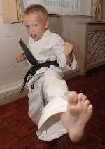 Boy becomes UK's youngest karate black belt