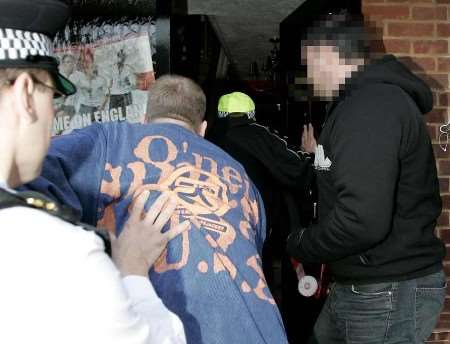 Police officers entering a property during one of the raids