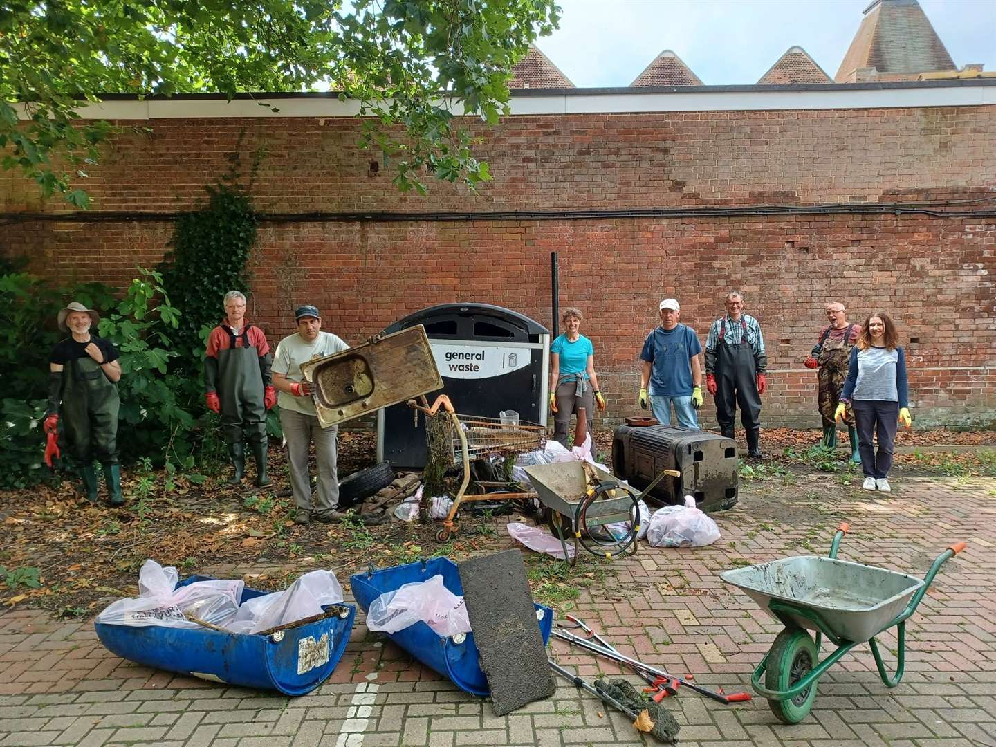 Volunteers with the pile of rubbish cleared from the Stour