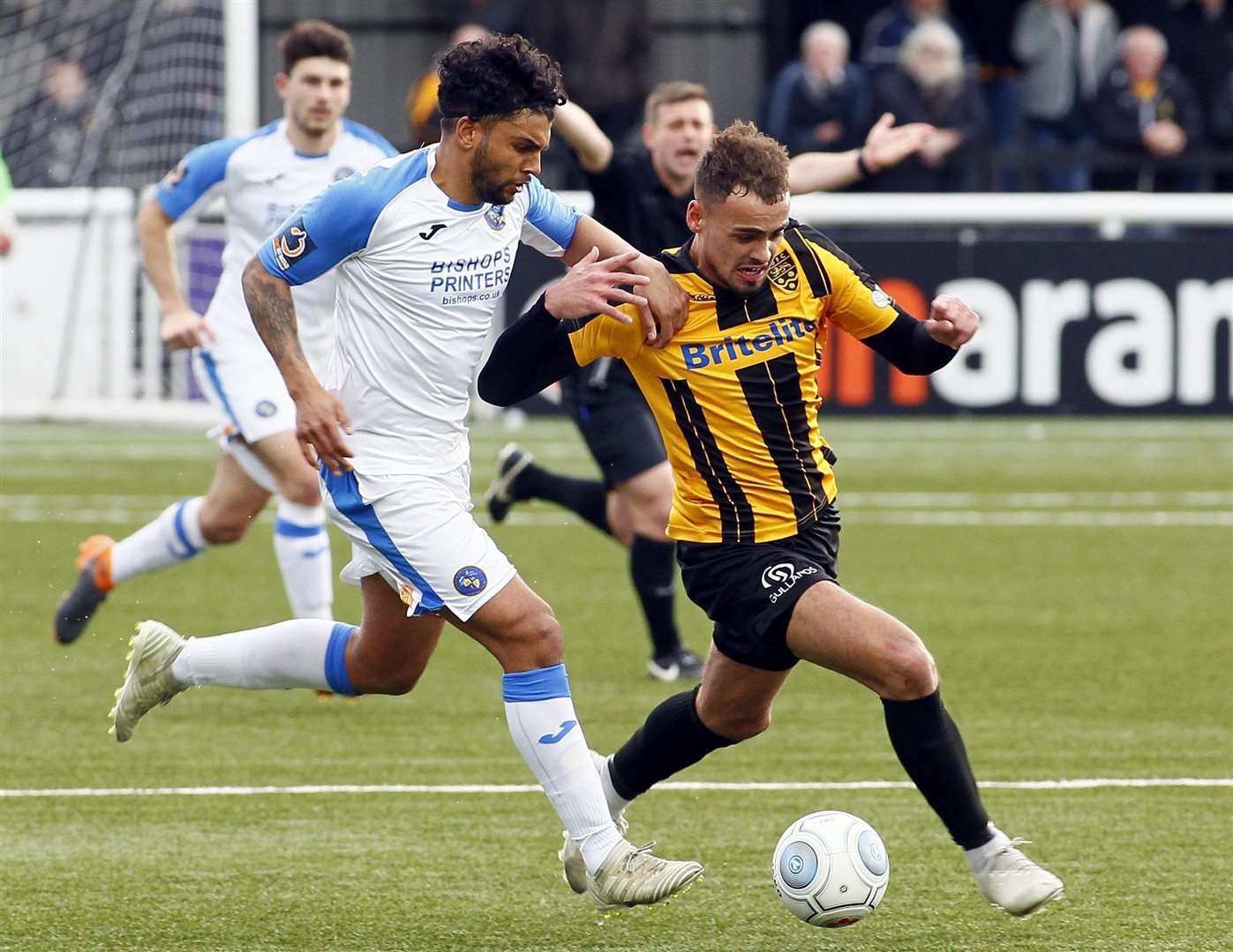 Maidstone midfielder Michael Phillips wins this tussle Picture: Sean Aidan